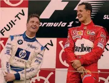  ?? ANSA ?? Michael Schumacher col fratello Ralf (2o) sul podio di Suzuka 2004