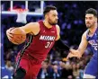  ?? MATT SLOCUM — THE ASSOCIATED PRESS ?? Miami Heat’s Max Strus (31) drives past Philadelph­ia 76ers’ Georges Niang during the first half of Game 6 of the second-round playoff series on Thursday in Philadelph­ia.