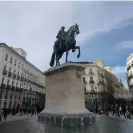  ?? Photograph: AfroIbéric­a Tours ?? Statue of King Carlos III in Puerta del Sol plaza.