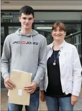 ??  ?? James Siberry with his mother Suzanne Siberry collecting his Leaving Cert results in the Grammar School.