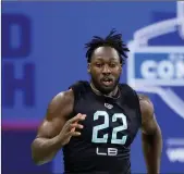  ?? Tribune News Service/getty Images ?? Utah linebacker Devin Lloyd runs the 40-yard dash during the NFL Combine at Lucas Oil Stadium on March 5 in Indianapol­is.