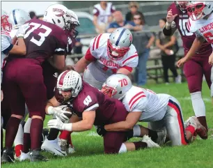  ?? Photo by Ernest A. Brown ?? Woonsocket sophomore running back Logan Coles (center) scores the first of his two touchdowns in a 54-6 Division II conquest of Lincoln Saturday at Barry Field.