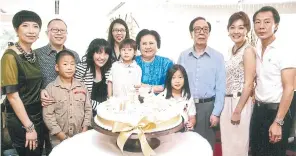  ??  ?? Ms Ghanyapad with her parents, Mr Pipat, 82, third from right, and Khunying Supatra, 80, fifth from right, along with their extended family.