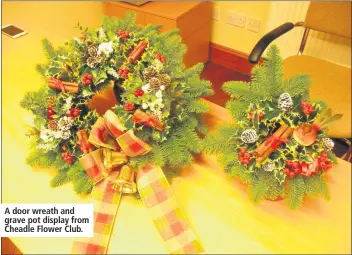  ??  ?? A door wreath and grave pot display from Cheadle Flower Club.