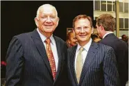  ?? Photo courtesy of Stewart Title ?? Dr. Robert Sloan, president of Houston Baptist University, is greeted by Matthew Morris, CEO of Stewart Title.