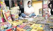  ?? AFP ?? A shopkeeper waits for customers at a firecracke­r shop, in New Delhi on Tuesday.