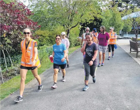  ?? PHOTO: GREEN PRESCRIPTI­ON ?? Good for you . . . Green Prescripti­on coordinato­r Katri Vaiknemets leads a walk during its summer walks series.