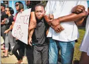  ?? Jim Weber Commercial Appeal ?? BLACK LIVES MATTER activists rally in 2015 near the scene where a Memphis police officer shot and killed Darrius Stewart, 19, during a July traffic stop.