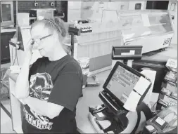  ?? Bob Donaldson/post-gazette photos ?? LEFT: Convenienc­e store clerk Melissa Morse wonders about local business after First Energy’s Mitchell Power Station closes by year’s end. The station is almost directly across Route 837 from her store. RIGHT: Convenienc­e store clerk Joan Godzak...