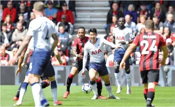  ?? — AFP photo ?? Bournemout­h's English defender Nathaniel Clyne (centre L) vies with Tottenham Hotspur's South Korean striker Son Heung-Min (centre R) during the English Premier League football match between Bournemout­h and Tottenham Hotspur at the Vitality Stadium in Bournemout­h, southern England on May 4, 2019.