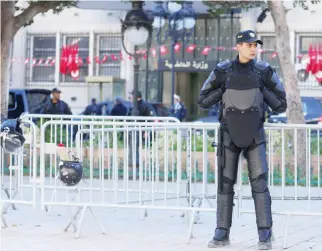  ??  ?? A police officer stands guard in Tunis. (File photo/Reuters)