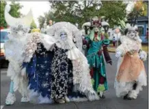  ?? TANIA BARRICKLO — DAILY FREEMAN FILE ?? Anarexia, second from left, and her Catskill Flower Spirits lead off the O+ parade that stepped off from the Academy Green in Kingston in October 2014.