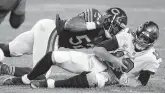  ?? JEFF HAYNES/ASSOCIATED PRESS ?? Bears outside linebacker Khalil Mack sacks Tom Brady during Chicago’s 20-19 victory Thursday over Tampa Bay.