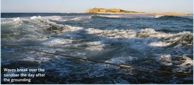  ??  ?? Waves break over the sandbar the day after the grounding