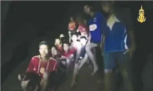  ?? AFPPIX ?? This handout video grab taken from footage released by The Royal Thai Navy on Monday shows the missing boys inside the Tham Luang cave.