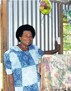  ?? Photo: DEPTFO ?? 65-year-old Naitauvoli villager, Mrs Nunia Rokobi switches on the power point at her home after the commission­ing of the rural electrific­ation project.
