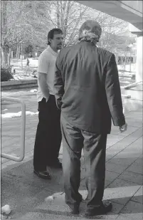  ?? JENNIFER SALTMAN/PNG ?? Ryan Jarrett Fairhurst, left, speaks to his lawyer outside provincial court in Surrey during a break in his hearing Thursday.