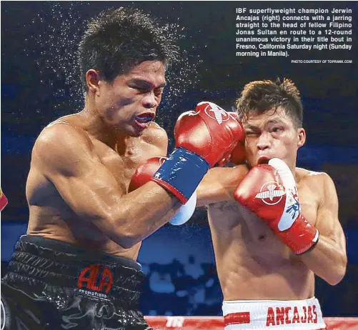  ?? PHOTO COURTESY OF TOPRANK.COM ?? IBF superflywe­ight champion Jerwin Ancajas (right) connects with a jarring straight to the head of fellow Filipino Jonas Sultan en route to a 12-round unanimous victory in their title bout in Fresno, California Saturday night (Sunday morning in Manila).