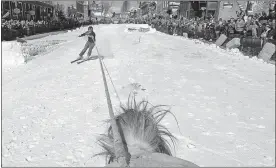  ?? THOMAS PEIPERT/AP PHOTO ?? A skier is pulled by a horse during a skijoring competitio­n in Leadville, Colorado.