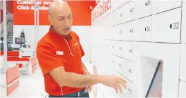  ??  ?? Chief executive Pejman Okhovat with the clickand-collect lockers in the new-look store.