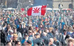  ??  ?? SMOKE SIGNALS: A rally for National Marijuana Day on Parliament Hill in Ottawa. Canada is only the second country to draft legislatio­n to fully legalise recreation­al marijuana use.