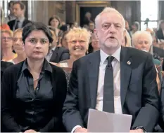  ?? CARL COURT/GETTY IMAGES ?? Opposition Labour Party leader Jeremy Corbyn, right, sits with Shadow Attorney General for England and Wales Shami Chakrabart­i, left, before making a speech on defence on Friday, in London. Corbyn stated that UK foreign policy would change under a Labour government to one that “reduces rather than increases the threat” to the country, as election campaignin­g resumed after the attack in Manchester earlier this week.