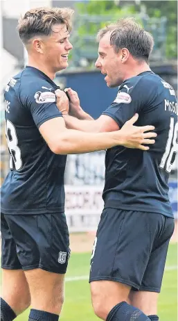  ?? Pictures: SNS Group. ?? Dundee midfielder Lewis Spence makes it 1-0 against Brechin at Dens, left, and celebrates his goal with Paul McGowan, above, who made it 2-0 in the 59th minute. Below: Jesse Curran moves in to tackle Brechin’s Sean Burns.