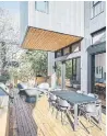  ??  ?? The large terrace adds
40 feet of outdoor living space that’s partially protected by the second-floor addition acting as a cantilever­ed roof.