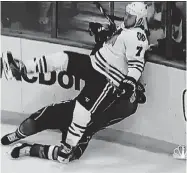  ?? | NBC ?? Defenseman Brent Seabrook levels Blues center David Backes with a check late in the third period. Seabrook drew a five-minute charging penalty and a game misconduct. “It wasn’t my intent,” Seabrook said.