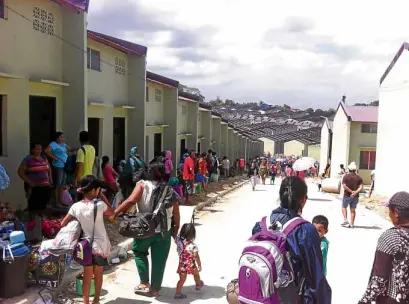  ?? —PHOTO COURTESY OFKADAMAY ?? Settlers occupy idle units in housing projects in Pandi town and San Jose del Monte City in Bulacan province, saying they have nowhere to go.