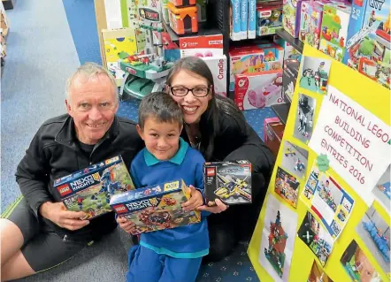  ?? PHOTO: ABBY BROWN ?? Winning the Matamata region of the National Lego Building Competitio­n gained Michael Magatogia and his mum Melanie Boeck $100 worth of free Lego from Matamata PaperPlus, which is owned by Graeme Guilford.