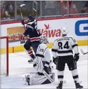  ?? MANUEL BALCE CENETA — THE ASSOCIATED PRESS ?? Kings goalie Cam Talbot and Vladislav Gavrikov are stunned as the Caps' Nic Dowd celebrates a last-minute winning goal.