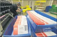  ?? TED S. WARREN — THE ASSOCIATED PRESS FILE ?? In this Aug. 5, 2020, file photo, vote-by-mail ballots are shown in sorting trays at the King County Elections headquarte­rs in Renton, Wash., south of Seattle.