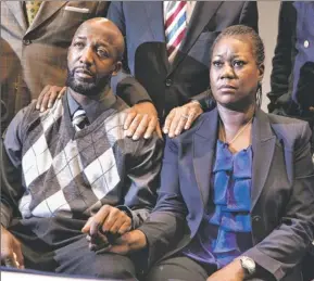  ?? By Evan Vucci, Afp/getty Images ?? “We just wanted an arrest:” The parents of Trayvon Martin, Sybrina Fulton, right and Tracy Martin watch Florida state attorney Angela Corey’s news conference Wednesday.