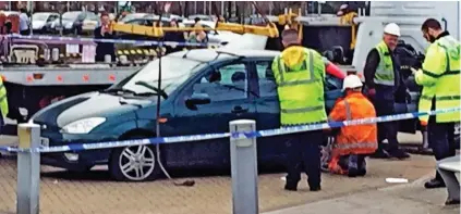  ??  ?? Aftermath: The Ford Focus at the scene of the tragedy in Manchester yesterday