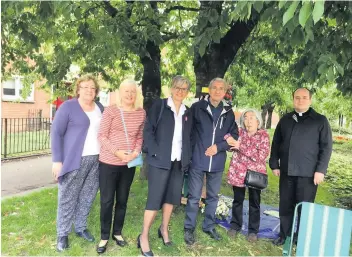  ??  ?? Remembranc­e The group who gathered in Rutherglen to remember the atomic bomb victims