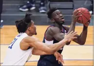  ?? Kathy Willens / Associated Press ?? Seton Hall center Ike Obiagu (21) defends against UConn forward Adama Sanogo (21) during the second half in March.