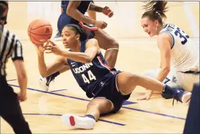  ?? Laurence Kesterson / Associated Press ?? UConn’s Aubrey Griffin (44) steals the ball from Villanova’s Sarah Mortensen during a December game.