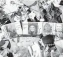  ?? JOURNAL
JAKE MAY/THE FLINT ?? Photograph­s of four slain students — Hana St. Juliana, Madisyn Baldwin, Tate Myre and Justin Shilling — at a memorial site at Oxford High School in Michigan.