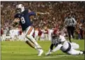  ?? BUTCH DILL - AP ?? Auburn quarterbac­k Jarrett Stidham (8) gets past Alabama linebacker Dylan Moses (18) to carry the ball in for a touchdown during their game on Nov. 25 in Auburn, Ala.