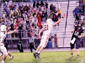  ?? PILOT FILE PHOTO ?? Plymouth’s Adriel Lester (21) puts pressure on this Northwood pass during last week’s final regular season game. The Rockies travel to No. 12 New Prairie for sectionals.