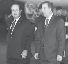  ??  ?? Hollande (left) is accompanie­d by Mexican Foreign Minister Antonio Meade upon arrival at the Benito Juarez Internatio­nal Airport in Mexico City. — AFP photo