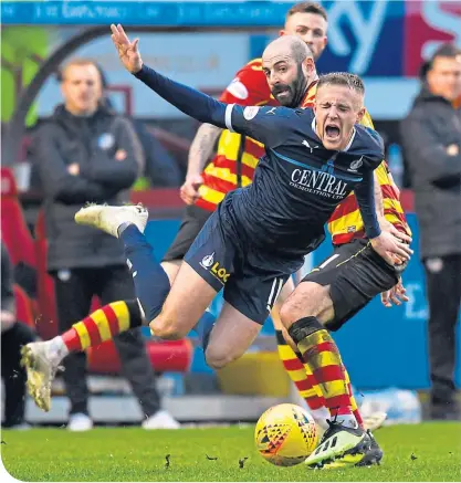  ??  ?? Falkirk’s MacLean goes flying in a challenge from Thistle’s Gary Harkins, who would later be given a second yellow for a much less innocuous takle on the same player – much to his manager’s fury