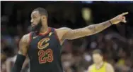  ?? TONY DEJAK — THE ASSOCIATED PRESS ?? The Cavaliers’ LeBron James talks with a teammate in the second half of Game 7 against the Pacers, Sunday in Cleveland.