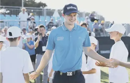  ??  ?? 0 David Law makes his way to the presentati­on ceremony after his weekend win in the ISPS Handa Vic Open.