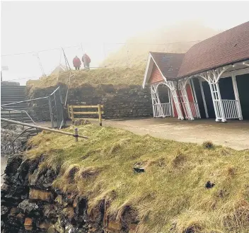  ??  ?? The chalets pictured after the landslip first happened