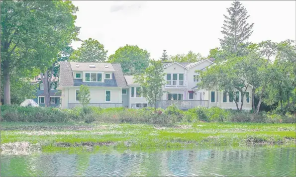  ?? Contribute­d photo ?? The four-bedroom, 3,825-square-foot single-family home at 18 Grimes Road, Old Greenwich, sits waterfront on Greenwich Cove. Berkshire Hathaway Home Services, New England Properties is the listing brokerage.