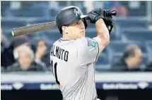  ?? ELSA/GETTY IMAGES ?? J.T. Realmuto returned to the lineup and had a three-run homer against New York.