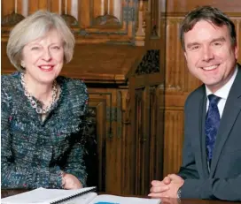  ??  ?? Going places: The minister with Prime Minister Theresa May