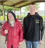  ?? MARAH MORRISON THE NEWS-HERALD ?? Bonnie Heasley, left, and Dylan LeMaster participat­e in the Willoughby Evening Lions Club’s white cane walk event.